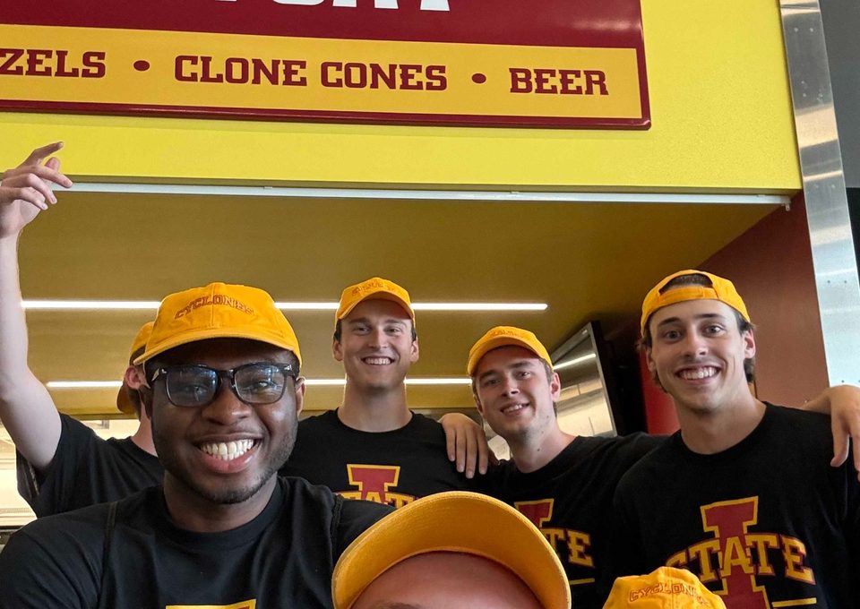 Student volunteers working together at an Iowa State concessions fundraiser.