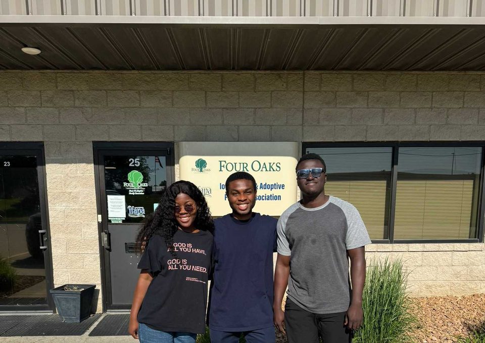 Volunteers standing outside a community organization after a service visit.